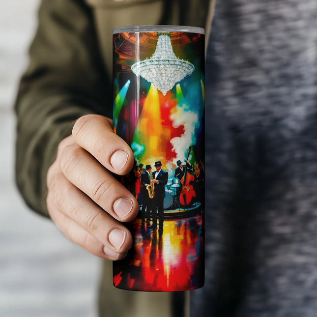 a person holding a coffee cup with a painting on it