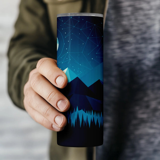 a person holding a travel mug in their hand