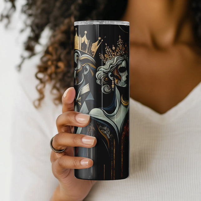 a woman holding a black and gold travel mug