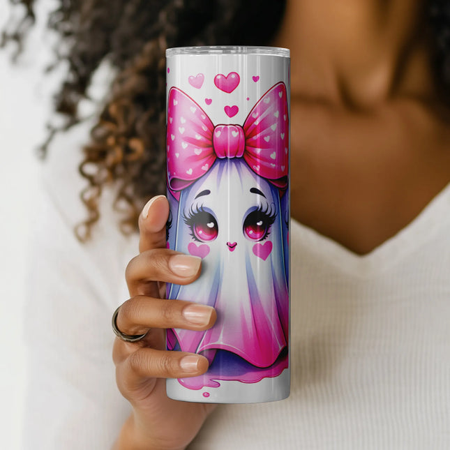 a woman holding up a cup with a picture of a unicorn on it
