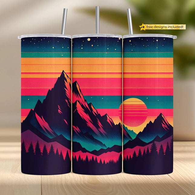 three travel mugs on a table with a mountain scene in the background