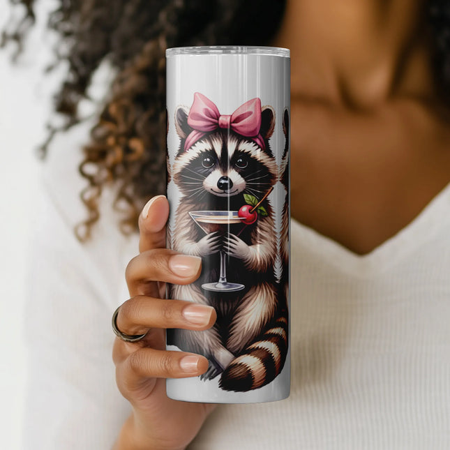 a woman holding a cup with a raccoon on it