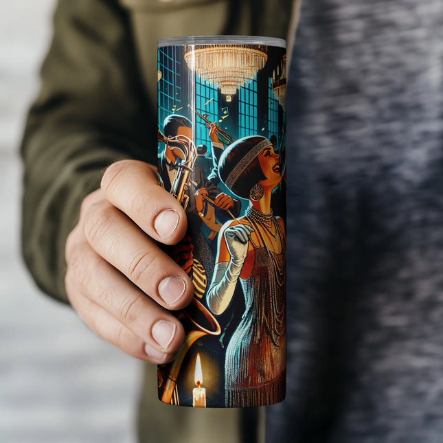 a person holding a coffee cup with a painting on it