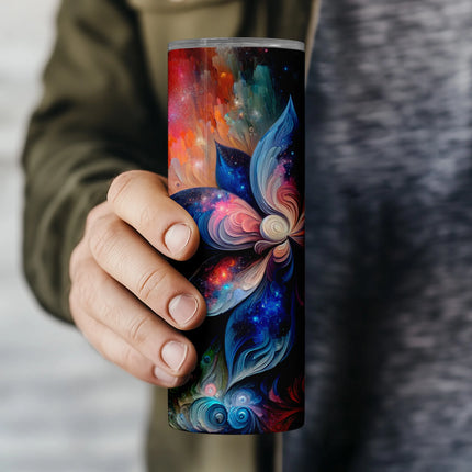 a person holding a colorful coffee cup in their hand