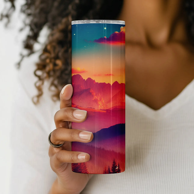 a woman is holding a cup with a painting on it