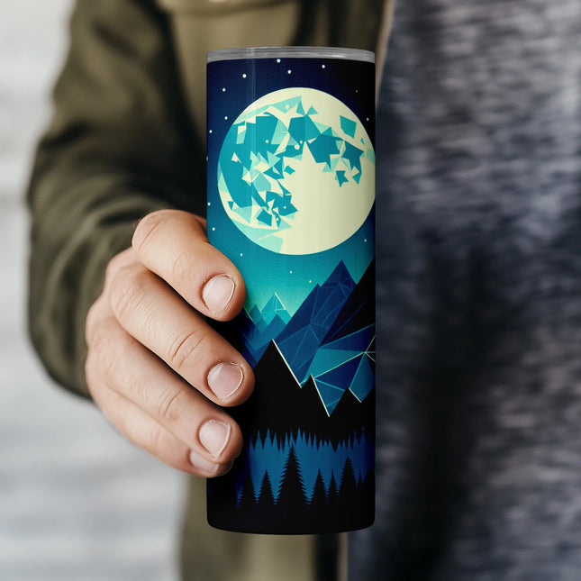 a person holding a travel mug with a full moon in the background