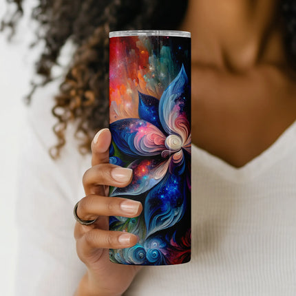 a woman holding up a colorful cup with a butterfly on it
