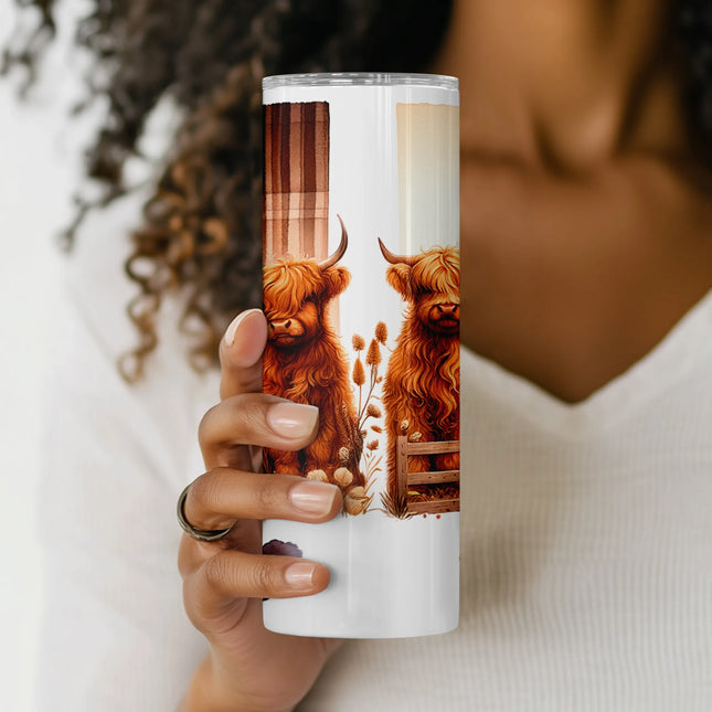 Sublimation tumbler design featuring a boho-style Highland cow with neutral florals.