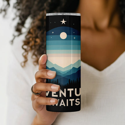 a woman holding a can of venture waits