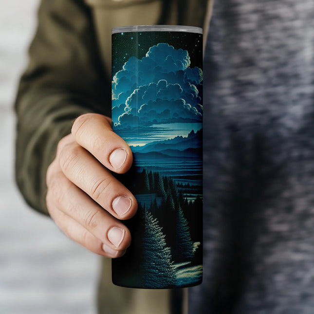 a person holding a cup with a painting on it