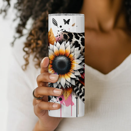 Close-up of sunflower center, layered feathers, and leopard background in artistic tumbler design.
