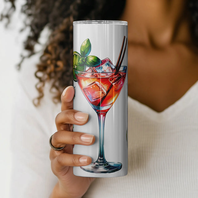 a woman holding up a cup with a drink in it