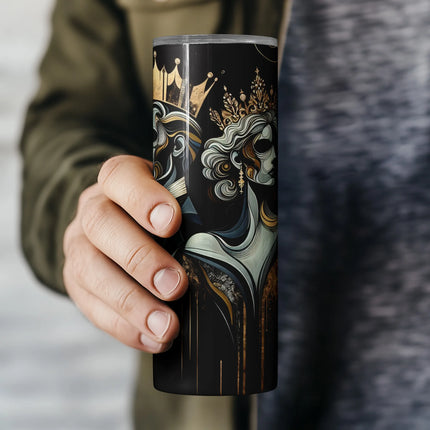 a person holding a coffee cup with a painting on it