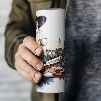 Elegant watercolor tumbler PNG featuring coffee, book, and Eiffel Tower scenery.