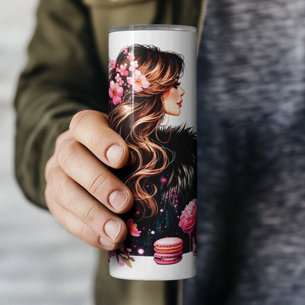 Champagne glass and confident Paris woman in black fur with pink florals and macarons.