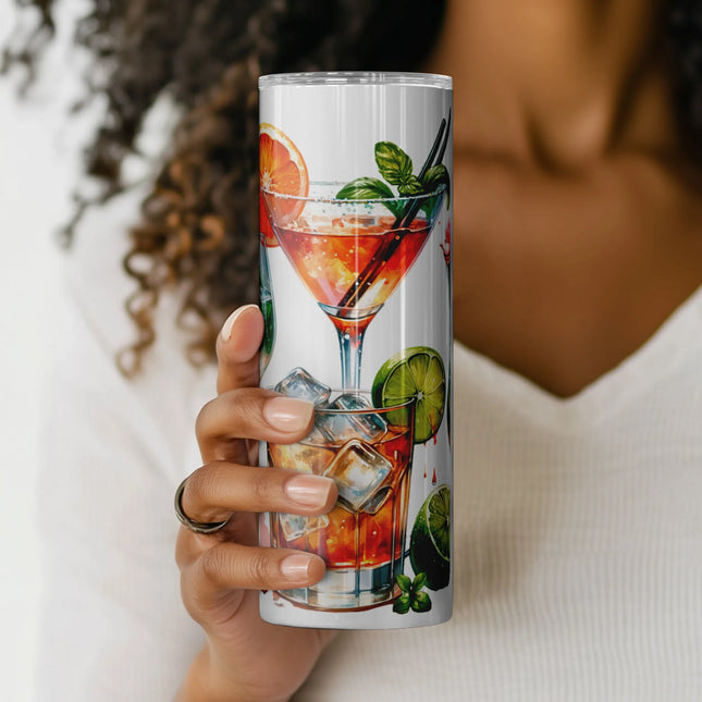 a woman holding a cup with a picture of a cocktail on it