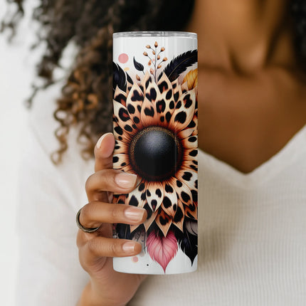 Mockup of 20oz skinny tumbler featuring boho-style sunflower with animal print petals and foliage.