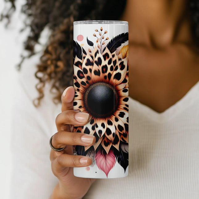 Mockup of 20oz skinny tumbler featuring boho-style sunflower with animal print petals and foliage.