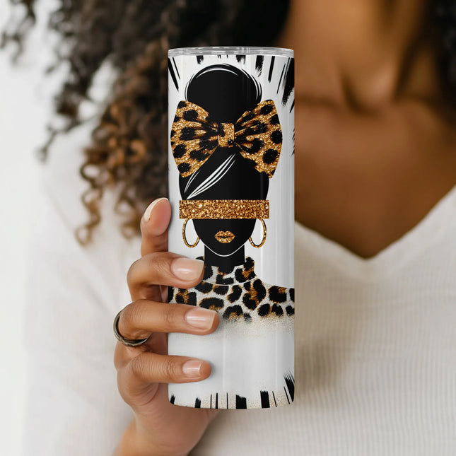 Close-up of glittery leopard bow and gold hoop earrings on chic fashion mom sublimation wrap.