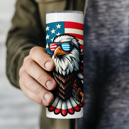 Close-up of eagle wearing American flag sunglasses with red, white, and blue wings in this fun sublimation wrap PNG.