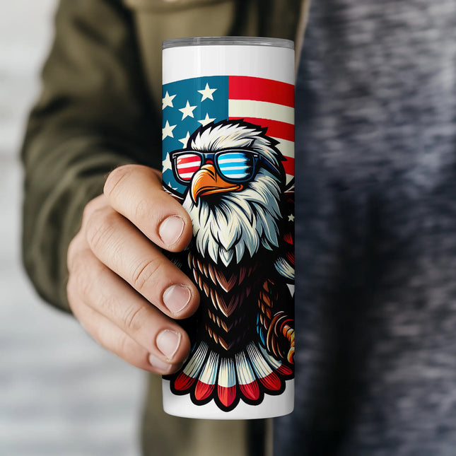 Close-up of eagle wearing American flag sunglasses with red, white, and blue wings in this fun sublimation wrap PNG.
